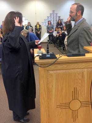 Harry Browne is sworn in during a ceremony for newly elected officials Thursday morning at the Grant County Administration Center.