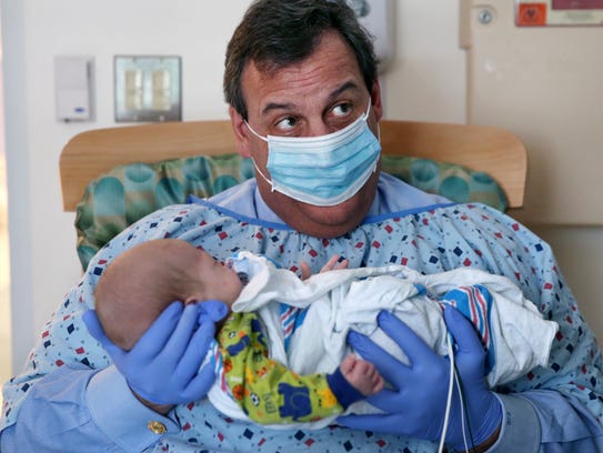 New Jersey Gov. Chris Christie holds a 49-day-old baby
