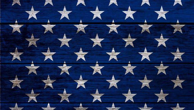 Image with decorative elements that refer to the American flag on wood background.