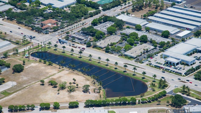 Scientists are dyeing the waters of this Naples Municipal Airport pond to test the effectiveness of underwater structures that were built to increased filtration by slowing water flow.