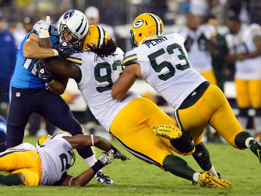 Green Bay Packers defensive tackle Josh Boyd (93) tackles Tennessee Titans wide receiver Marc Mariani (83) during the first half at LP Field. Mandatory Credit: Don McPeak-USA TODAY Sports