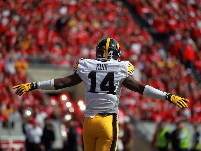 Iowa's Desmond King celebrates after forcing a fourth