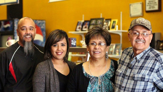 From left, Ernie Holguin, Veronica Mercado, Bessie Holguin and Ernest Holguin will be turning over their family business, Waymaker Christian Store, to new owners Tuesday. The coffee and gift shop served locals and travelers for 16 years and will host a farewell reception day for customers Tuesday.