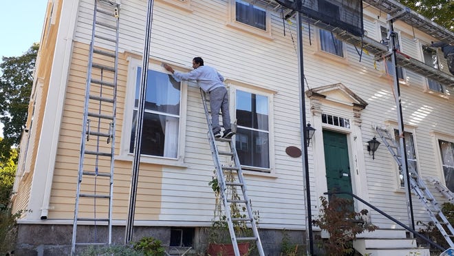 The exterior of the Osgood House is being repainted as part of the restoration  of the 18th century house in Medford.