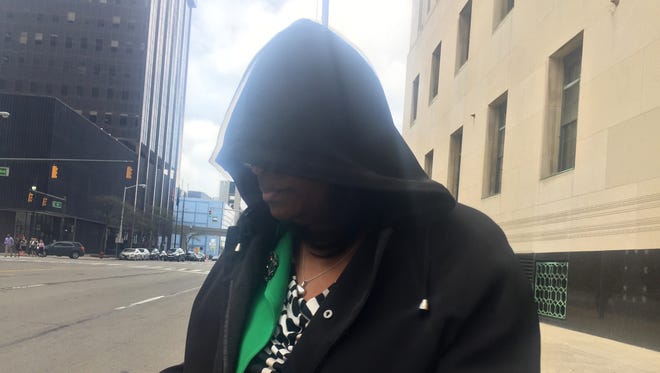 Tia’von Moore-Patton, 46, of Farmington Hills, principal of Jerry White Center High School, leaves federal court on Thursday, May 12, 2016 in Detroit. She is charged with accepting $4,000 in kickbacks from Shy.