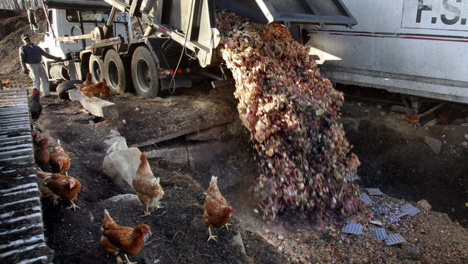 Dumping food scraps at a compost in Montpelier, Vt., in 2013.