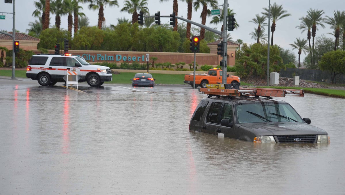 Rain in Palm Desert floods roads, strands vehicles