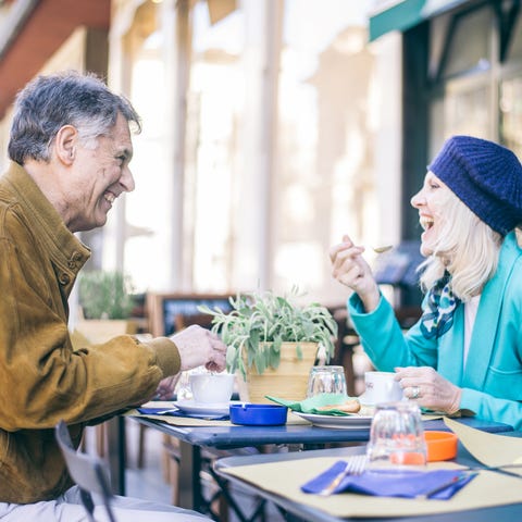 Older man and woman dining out