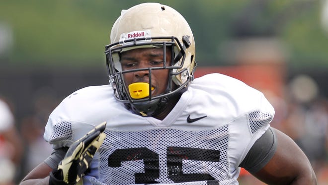 Linebacker Ja'Whaun Bentley runs a drill Aug. 9, 2014, at the Bimel Practice Complex on the campus of Purdue University.