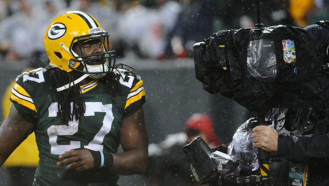 Green Bay Packers running back Eddie Lacy (27) has a moment with a camera operator after his first quarter touchdown against the Chicago Bears at Lambeau Field.