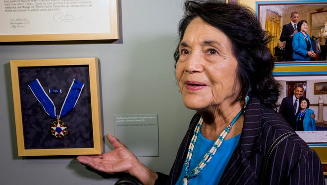 This April 10, 2014 photo Dolores Huerta, co-founder of United Farms Workers, shows her Presidential Medal of Freedom Award at La Plaza de la Cultura y Artes museum in Los Angeles. Civil rights icon Huerta says she holds no ill feelings toward actress Rosario Dawson over her "open letter" criticizing Huerta for supporting Hillary Clinton.