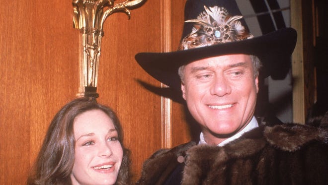 In this Nov. 21, 1980, file photo, actress Mary Crosby and actor Larry Hagman, who plays J.R. Ewing in the popular TV series "Dallas," appear at a party in Los Angeles. Crosby starred as Kristin Shepard, the sister of Sue Ellen, and the woman who shot J.R. As many as 90 million viewers in the U.S. alone tuned to "Dallas," Nov. 21, 1980, to find out who shot J.R. Ewing.