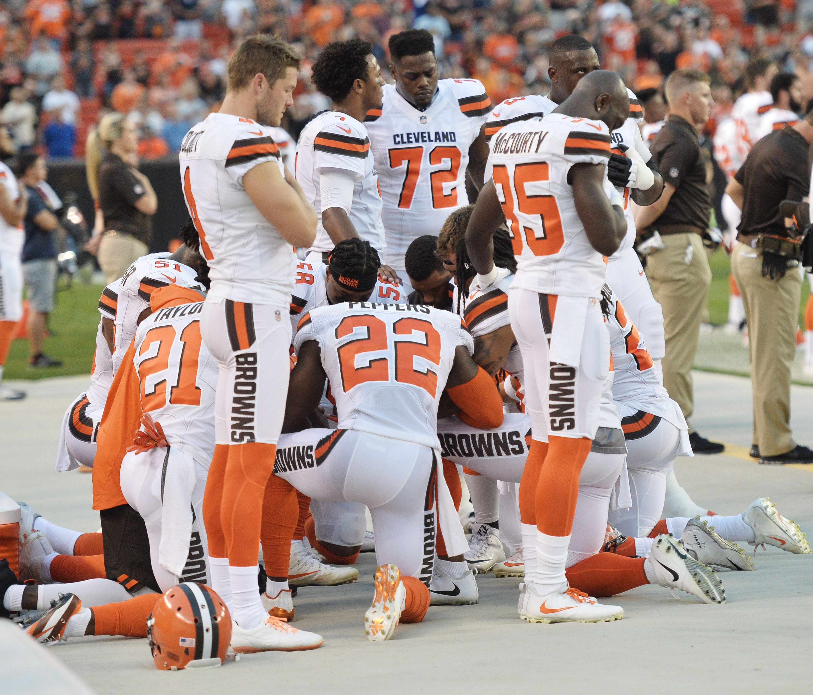 Members of the Cleveland Browns kneel during the national anthem before a game against the New York Giants at FirstEnergy Stadium.