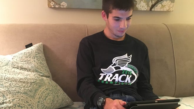 John Perry, a junior at Yorktown High School, works on his presentation for Fields of Faith on Oct. 5. Perry has severe dyslexia which affects his speech, but he's standing up to inspire others to overcome challenges.