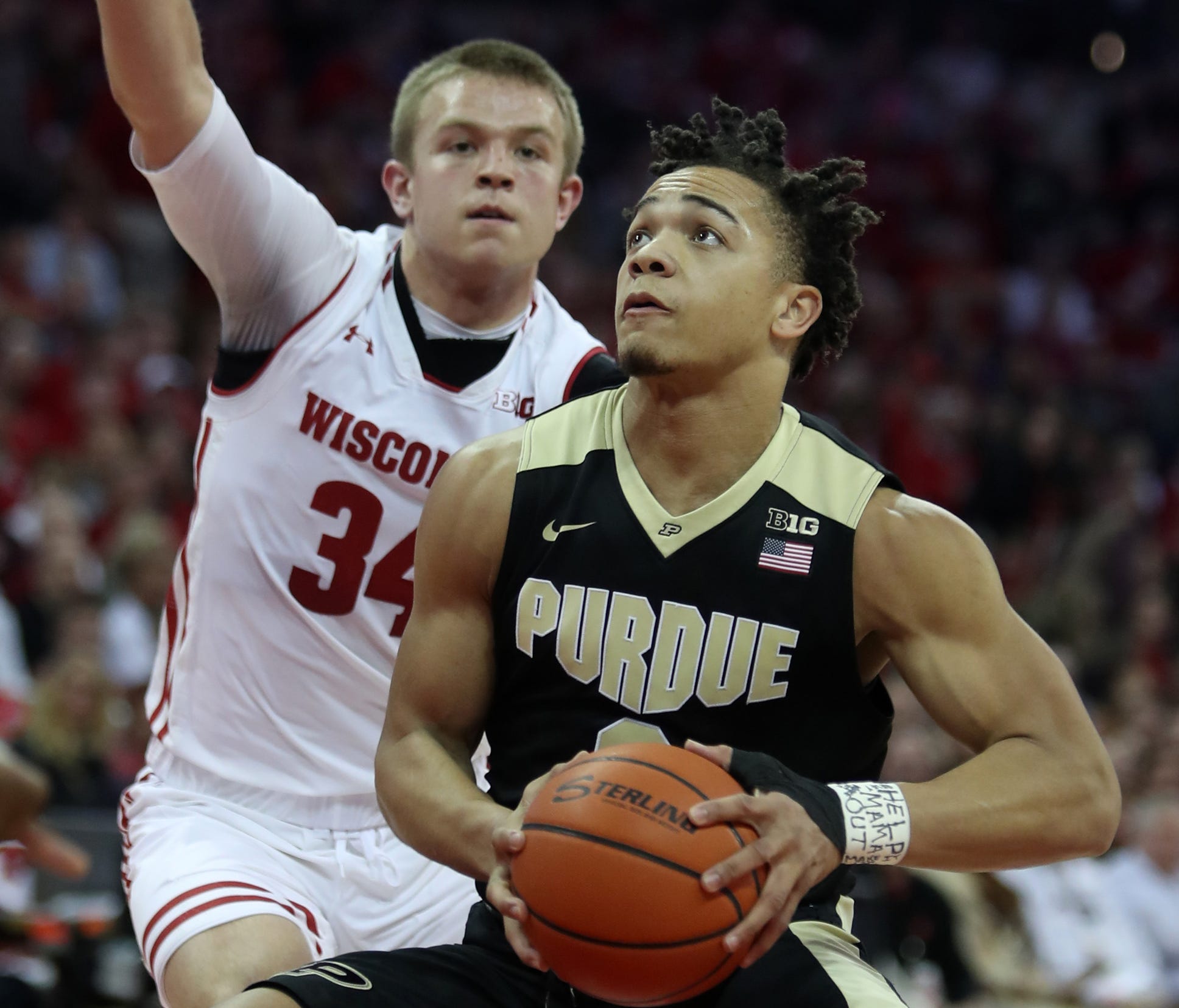 Purdue Boilermakers guard Carsen Edwards (3) looks to shoot as Wisconsin Badgers guard Brad Davison (34) defends at the Kohl Center.