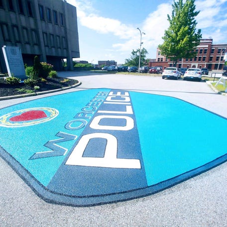 WORCESTER - A painting of the Worcester Police Department emblem on the pavement in front of the police station, shown Sunday, has been completed.