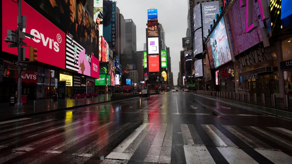 Times Square is mostly empty Monday in New York. Gov. Andrew Cuomo has ordered most New Yorkers to stay home from work to slow the coronavirus pandemic.