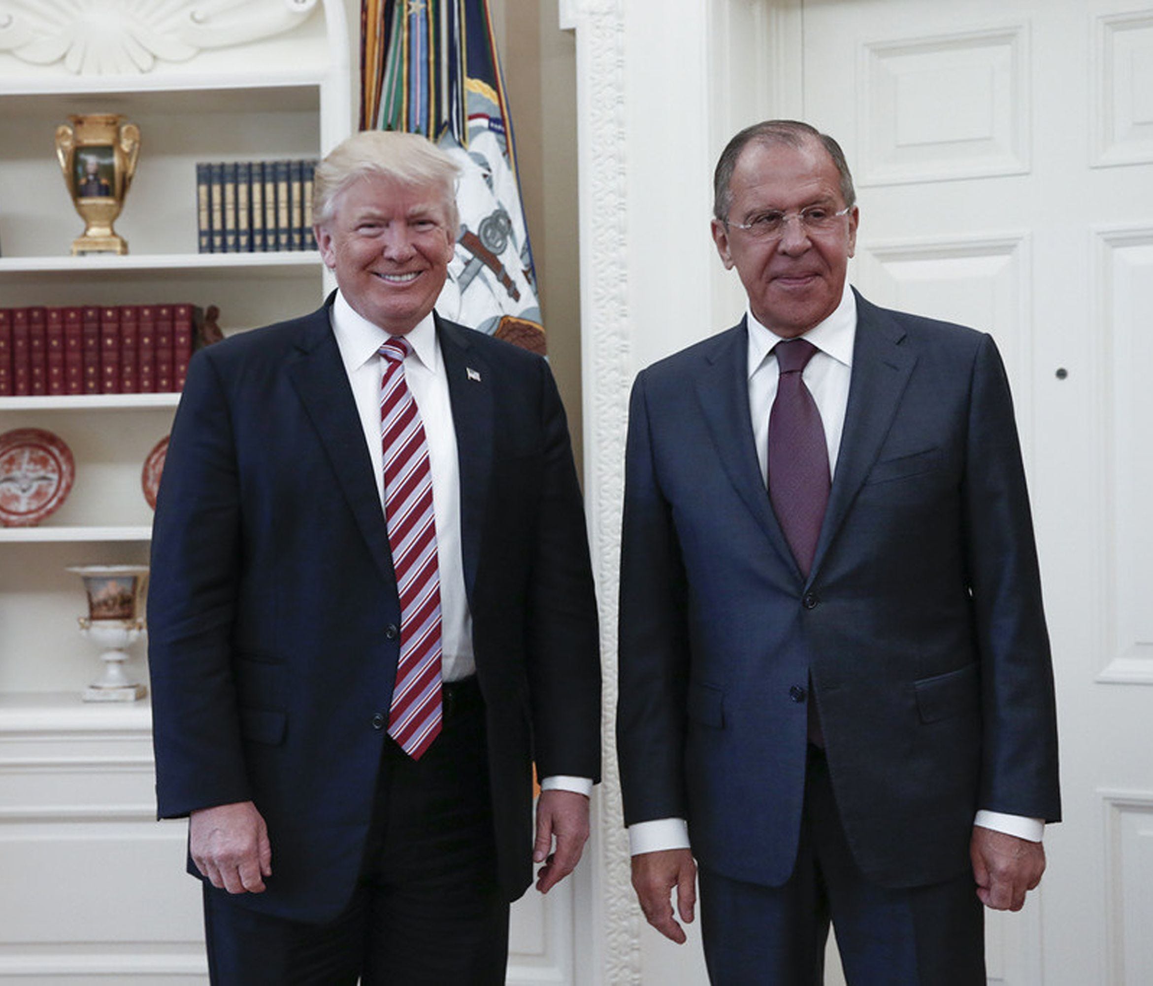 This file handout photo taken on May 10, 2017 made available by the Russian Foreign Ministry shows shows US President Donald J. Trump posing with Russian Foreign Minister Sergei Lavrov during their meeting at the White House. (Editor's note: USA TODA