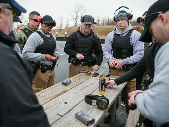 New Castle County Police recruits load their magazines