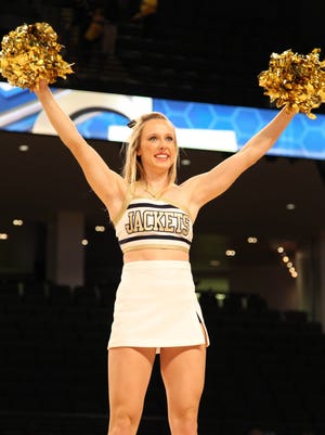 A Georgia Tech Yellow Jackets cheerleader performs.