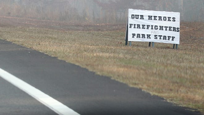 A sign supporting firemen bearing the message "Our Heroes Firefighters and Park Staff" is seen near Table Rock State Park on S.C. 11 north of Pickens.