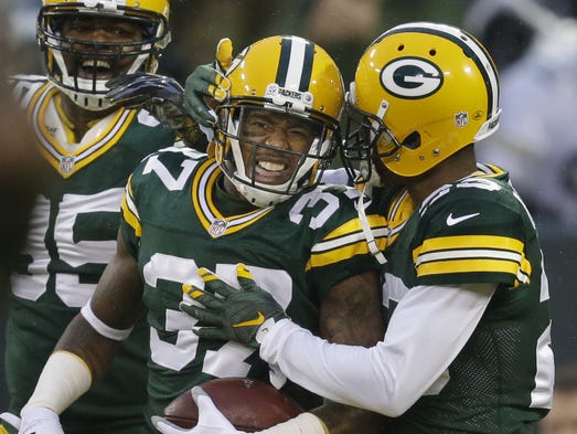 Green Bay Packers cornerback Sam Shields, left, celebrates