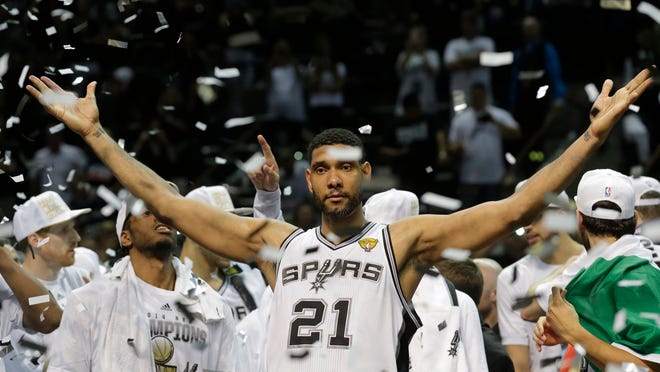 
San Antonio Spurs forward Tim Duncan celebrates after Game 5 of the NBA Finals on Sunday. The Spurs won their fifth NBA championship after beating the Miami Heat, 104-87. 
