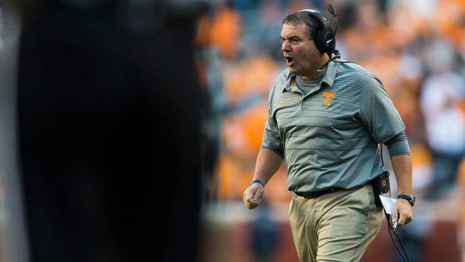 Tennessee Interim Head Coach Brady Hoke yells to players during a game between Tennessee and Vanderbilt at Neyland Stadium in Knoxville, Tenn., on Saturday Nov. 25, 2017.