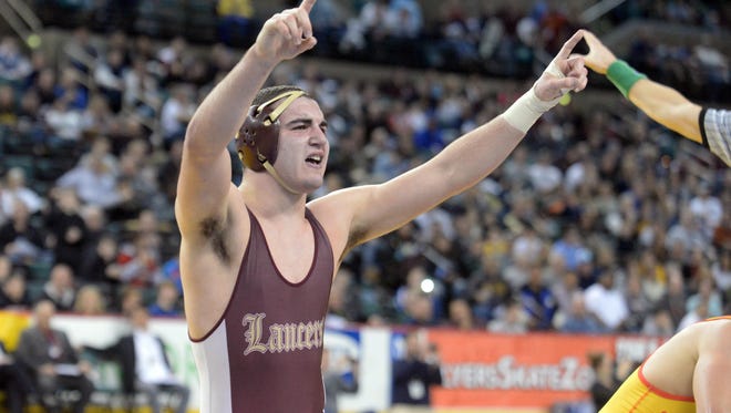 Matt Correnti of Holy Cross reacts after defeating Bergen Catholic's Danny DeLorenzi during Saturday's state wrestling championships at Boardwalk Hall in Atlantic City in Jan. 2015.