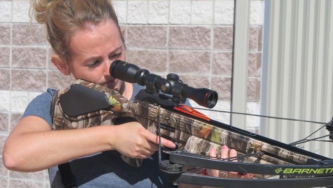 Arica Johns of Bolivar takes aim at a target with a crossbow.