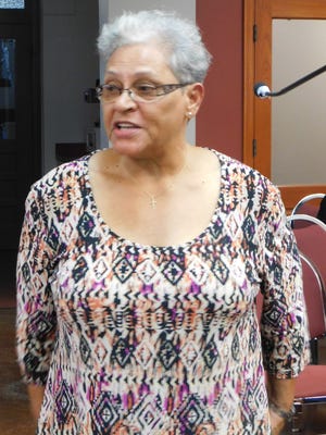 Lawtell resident Lois Collins speaks to the St. Landry Parish Council last week. She urged members to do something about the dirt and gravel roads in the parish that are in disrepair.