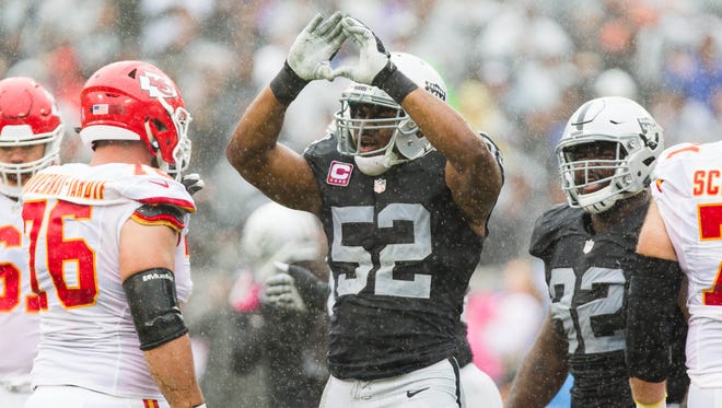 Oakland Raiders defensive end Khalil Mack (52) celebrates after a sack against the Kansas City Chiefs during the first quarter at Oakland Coliseum.