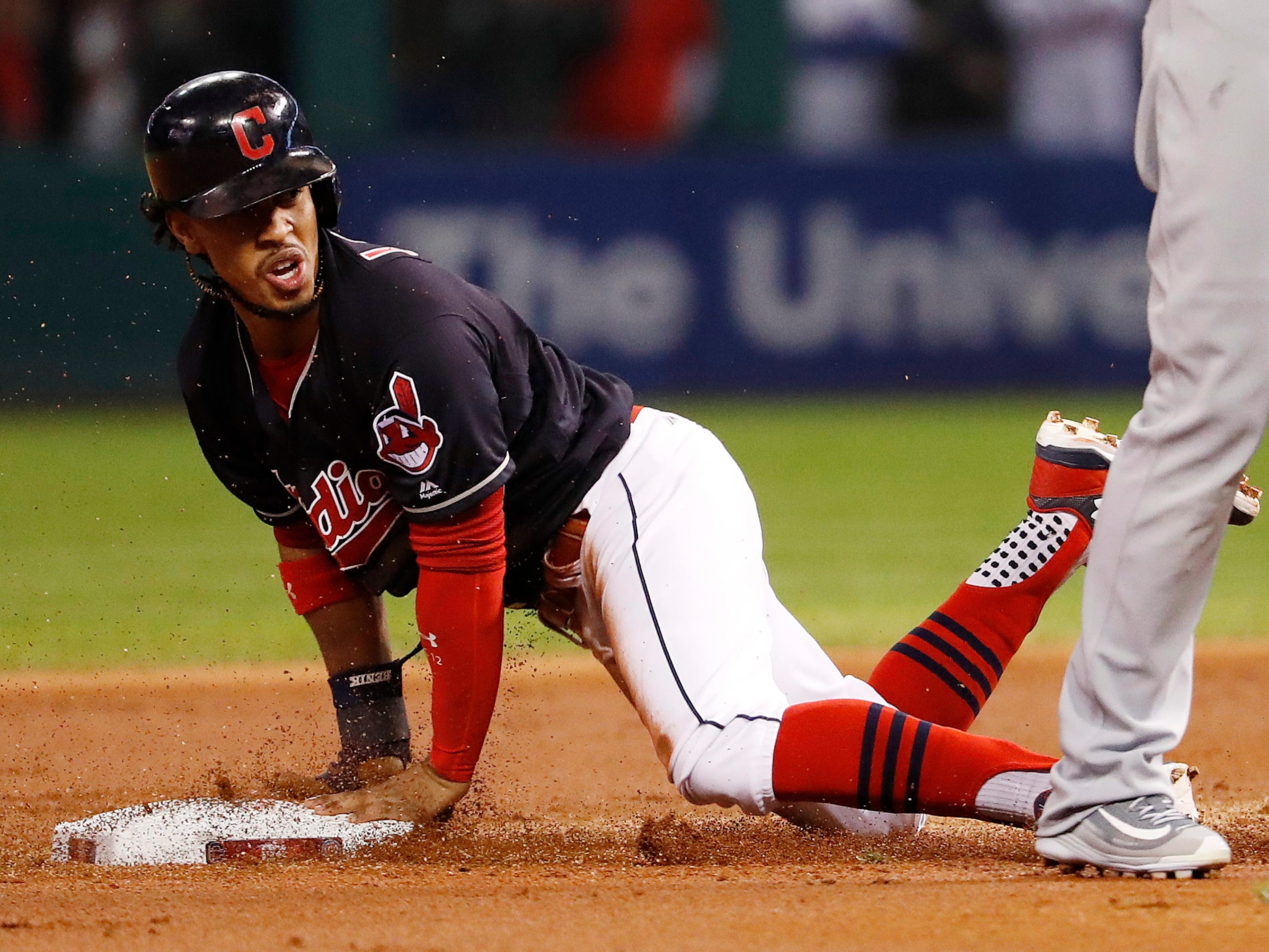 Cleveland Indians baserunner Francisco Lindor steals second base in the bottom of the first inning of game one of the World Series between the Chicago Cubs and the Cleveland Indians at Progressive Field in Cleveland, Ohio.