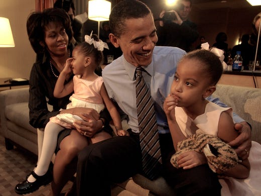Illinois Sen. Barack Obama  and his wife Michele hold