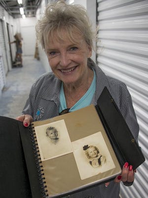 Karolyn Grimes today with  album of childhood photos.