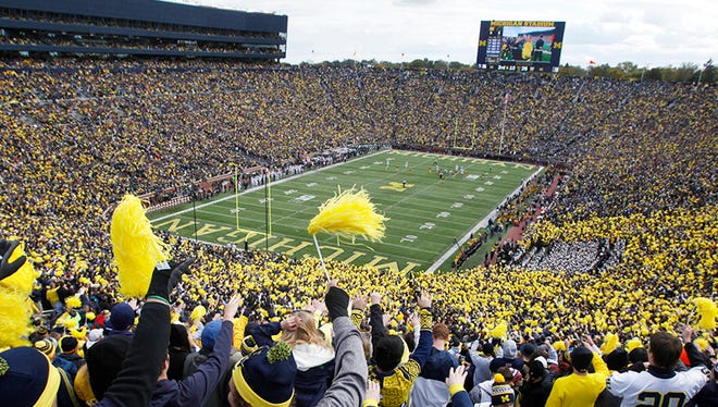 Fans cheer in the Big House for a game between Michigan and Michigan State in Ann Arbor, Saturday, Oct. 17, 2015.