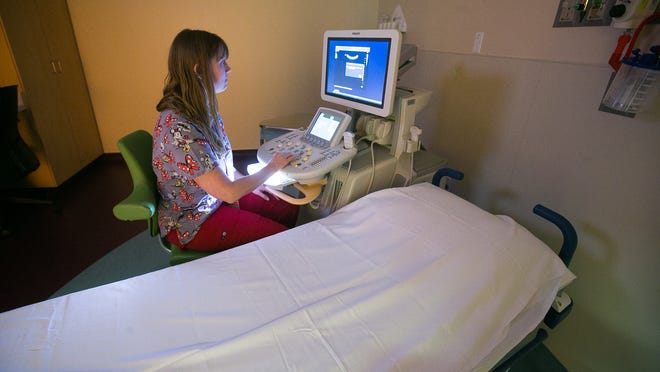 Ultrasonographer Nancy Tate does quality control on an ultrasound machine at Phoenix Children's Southwest Valley Center in Avondale on Wednesday, February 25, 2015.
