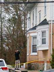 Newark police investigate after a 20-year-old man fell from the roof of a home on W. Main Street during a party in 2016.