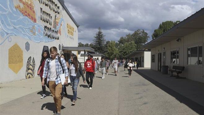 Enterprise High School students walk past portables between class periods at the Redding school.