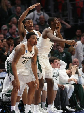Nick Ward, Xavier Tillman and Jaren Jackson Jr. react