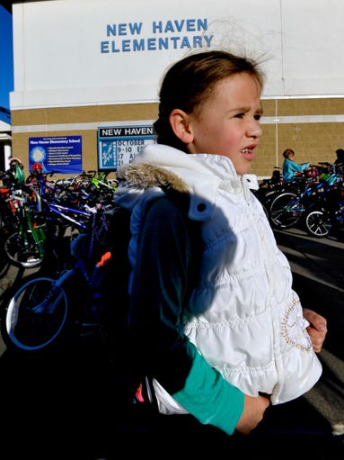 Gabby Goetz, 7, of New Haven, prepares to join her