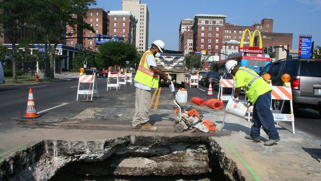 An MSD crew wraps up fixes to a sewer collapse that's slowed traffic on East Broadway this week.