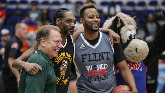 Snoop Dogg poses with Michigan State Basketball head coach Tom Izzo, former Toronto Raptor player Morris Peterson and and Pistons mascot Hooper during the Hoop 4 Water celebrity basketball game at the Dort Federal Event Center in Flint on Saturday May 21, 2016. Proceeds from the event will go toward the Morris Peterson Jr. Foundation for water relief efforts.