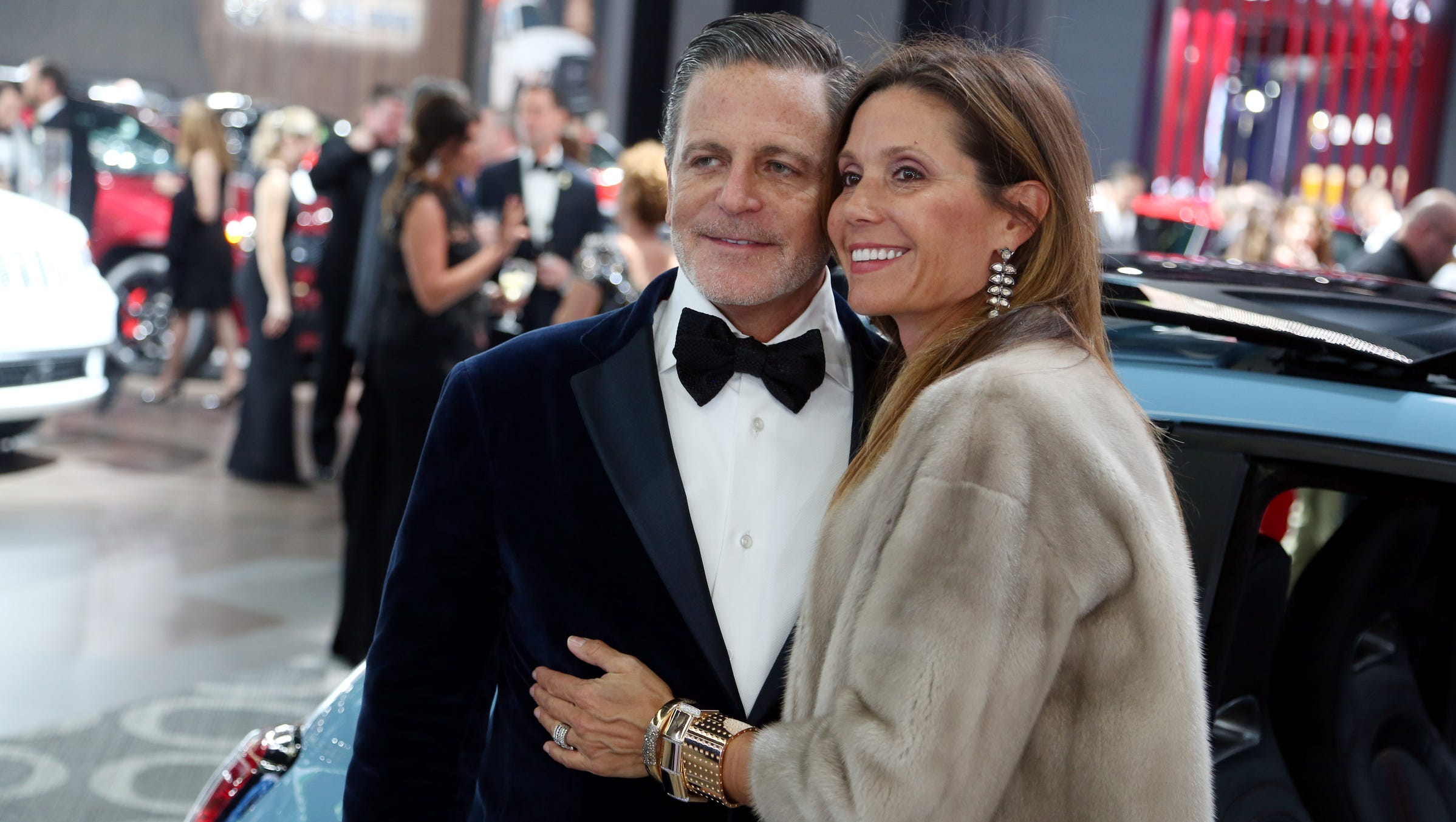 Dan Gilbert, Founder and Chairman of Quicken Loans poses with his wife, Jennifer Gilbert during the 2016 North American International Auto Show Charity Preview at Cobo Center on Friday, Jan. 15, 2016 in Detroit. 