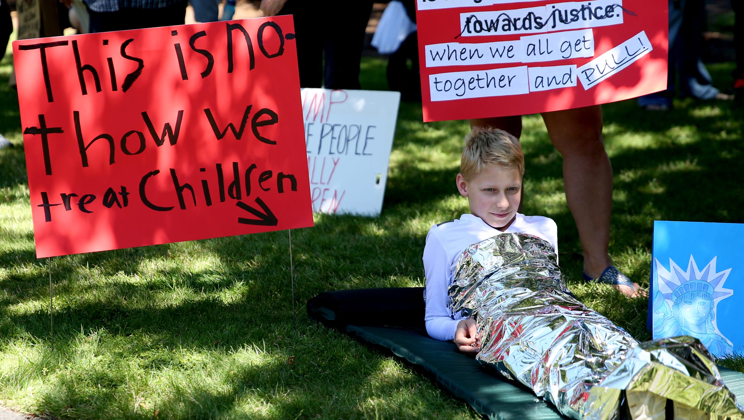 Soren Urban, 13, of Salem, wraps himself in a space