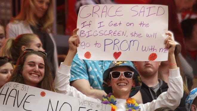 An Indianola fan makes a pitch to get Indianola junior Grace Berg to go to prom with him during last year's state basketball tournament at Wells Fargo Arena.