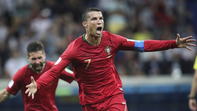 Cristiano Ronaldo celebrates a goal against Spain in the World Cup group stage.