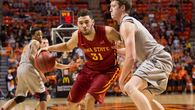 Iowa State Cyclones forward Georges Niang (31) fights for position against Oklahoma State Cowboys forward Mitchell Solomon (41) during the first half at Gallagher-Iba Arena.