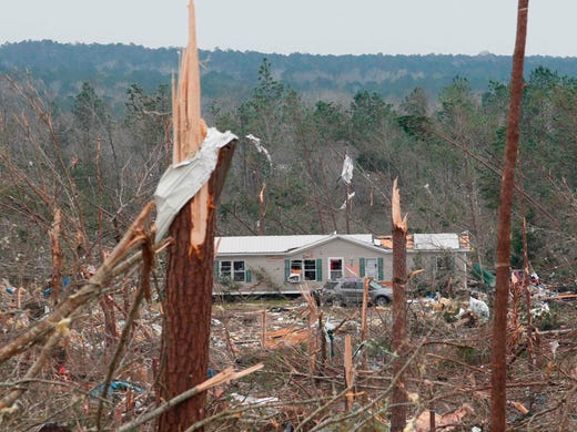 Damage is seen from a tornado which killed at least