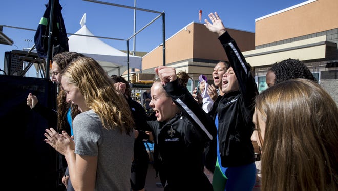 Notre Dame Prep celebrates after winning the Division I girls swimming state championship on Saturday, Nov. 7, 2015 at Skyline Aquatic Center in Mesa, AZ.